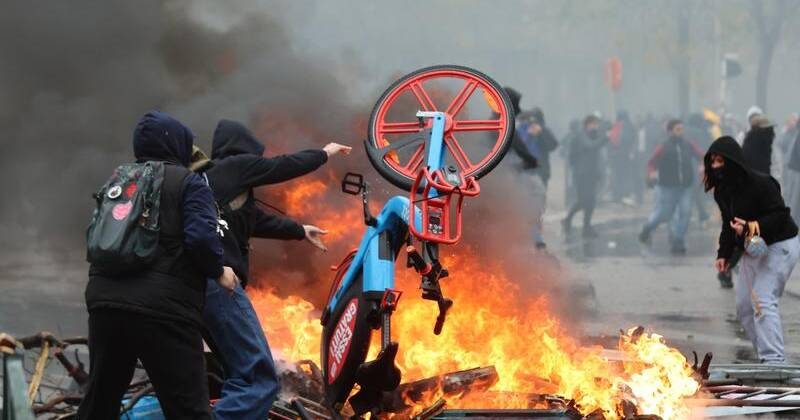 migrant student riots spread to Belgium, ANTIFA joins them
