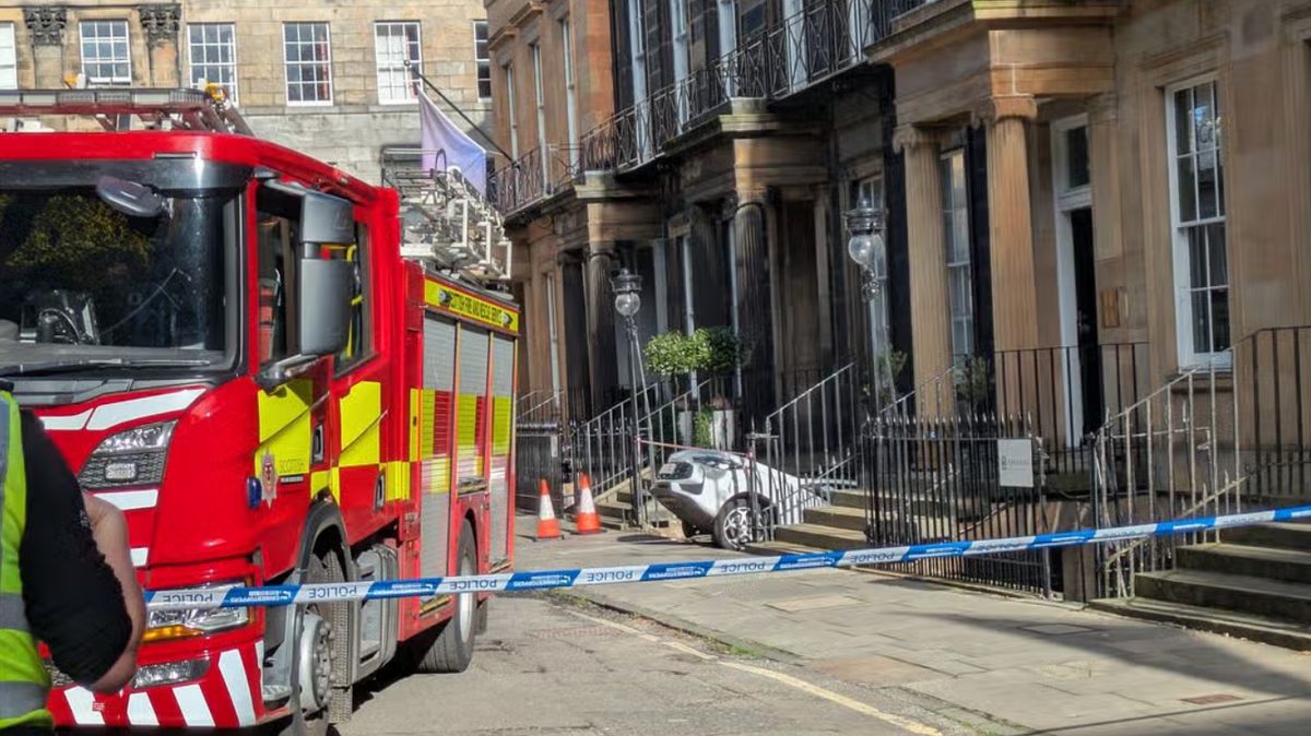 Car crashes into basement on busy Edinburgh street as woman charged