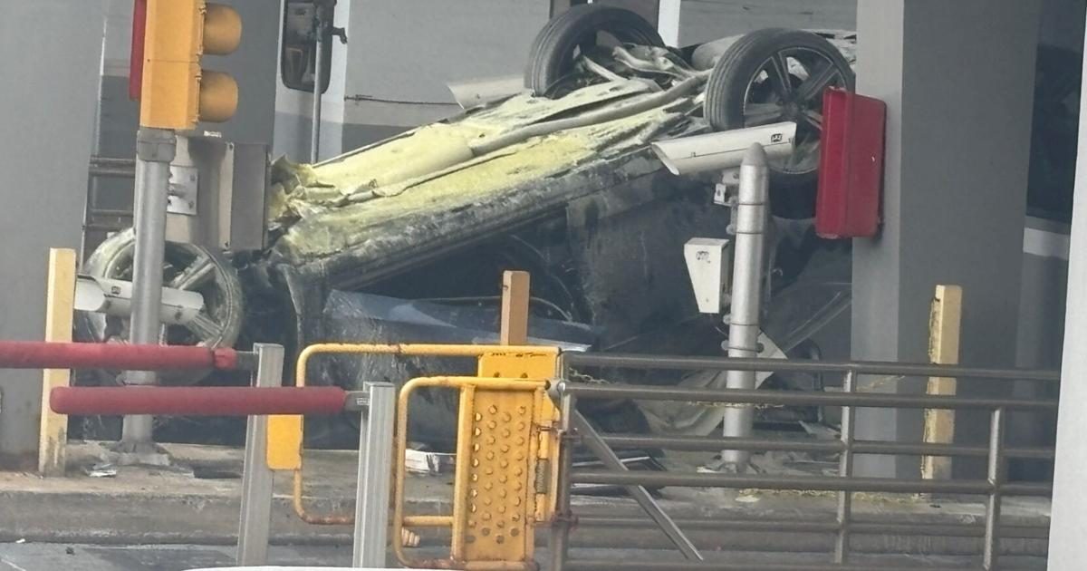 Vehicle overturns and catches fire at the Delaware Memorial Bridge toll plaza