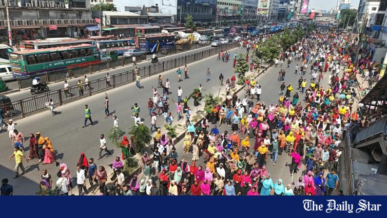 Garment workers block roads in Uttara's Rajlokkhi demanding wage hike