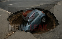 SINKHOLE SWALLOWS TINY DICK COMPENSATION VEHICLE